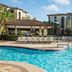 Sheraton Vistana Villages Resort Villas, I-Drive/Orlando pool with lounge chairs and resort buildings in Orlando