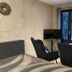 Country-Suites By Verdino Living - Apartments & Privatzimmer in Braunlage guest room with chairs, TV and balcony doors