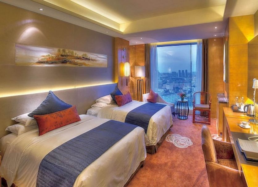 Felton Grand Hotel Chengdu guest room with twin beds and city view in Chengdu