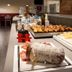 Breakfast buffet at Una Hotels Le Terrazze Treviso Hotel & Residence in Villorba with pastries and cold cuts