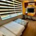 Nif Ankara Hotel room with twin beds, desk, TV, and window blinds in Ankara