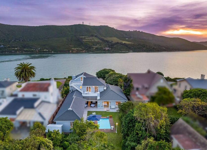 The Knysna Belle Guest House in Knysna with lagoon, hills, and sunset view over nearby houses