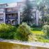 Glacier Lodge in Whistler exterior with mountain-style balconies and landscaped garden