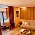 Boutique Hotel Casa Teatro, Manaus: cozy suite with sofa, bed, and warm wood-paneled interior