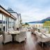 The Whispering Pine Lodge in Spean Bridge terrace seating overlooking a lake and mountains