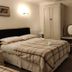 The Arundel Park Hotel in Arundel, guest room with double bed, wardrobe, dresser and wall TV