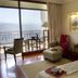 Ananda in the Himalayas room with balcony, mountain view, and seated chair in Rishikesh