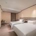 Hanting Hotel Dongguan Changan Wanda room with two twin beds in Dongguan