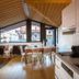Chalet Hotel Régina in Les Gets with wood-paneled dining area and large mountain-view windows
