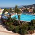 Grand Hotel La Pace in Sorrento with a large outdoor pool, sun loungers, and mountain views