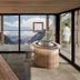 Hotel Kirchenwirt in Kaunertal room with panoramic alpine valley and mountain views through floor-to-ceiling windows