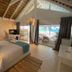 El Mosquito Boutique Hotel Playa Bonita in Las Terrenas: airy room with bed, balcony and ocean-view seating