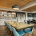 The Casso, Raleigh, a Tribute Portfolio Hotel dining area with long communal table and bar seating