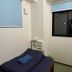 Guest House Wind Villa Kyoto room with twin beds, blue accents and a window view