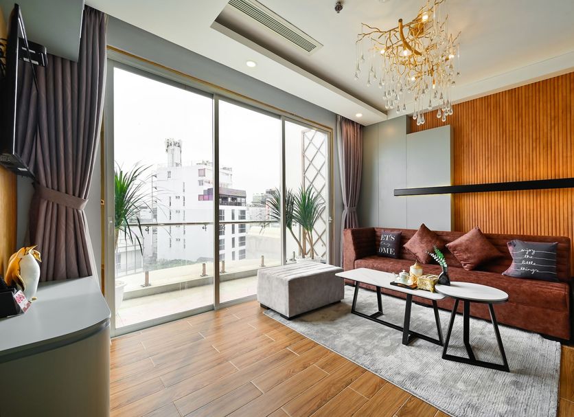 Cicilia Saigon Center in Ho Chi Minh City suite with balcony, city view, sofa and coffee table