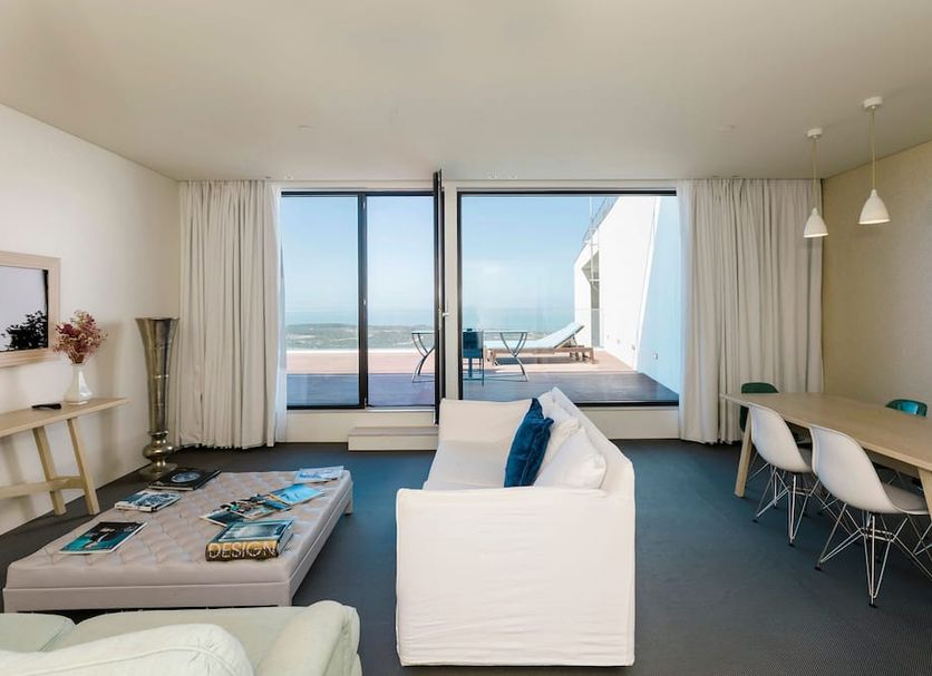 Royal Obidos Spa & Golf Resort suite with terrace, ocean view, sofa bed and dining table in Óbidos