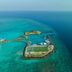 Aerial view of Emerald Faarufushi Resort & Spa in Ifuru with overwater jetty and turquoise lagoon