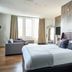 Hotel Du Vin & Bistro Tunbridge Wells room with king bed, sofa, and large window in Royal Tunbridge Wells