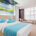 Marriott Hotel Yunfu guest room with king bed, lake mural headboard, and large window