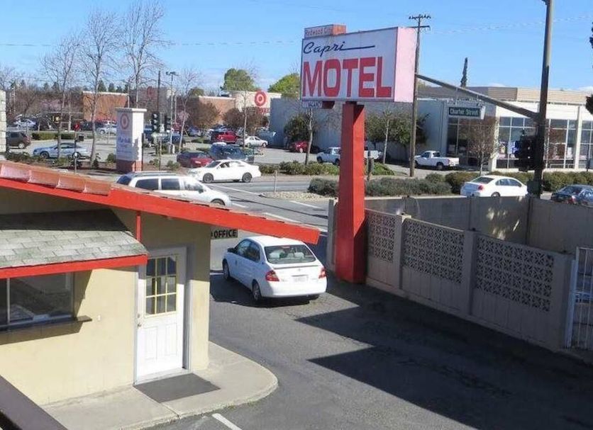 Capri Motel in Redwood City exterior with parking lot and roadside sign