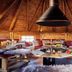 Nürburgring Ferienpark in Nuerburg: rustic wooden lounge with central fire pit and benches