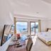 Gardenia Hotel in Kaş room with balcony sea view, TV, desk and bed