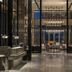The St. Regis Hong Kong lobby with polished stone floors, chandeliers, and seating area in Hong Kong