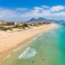 Vila Baleira Suites in Porto Santo overlooking a long sandy beach and turquoise ocean
