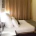 C Hotel Tiberias guest room with double bed, desk, TV and wood floors in Tiberias