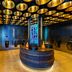 Five Zurich - Luxury City Resort in Zurich restroom with circular sink island and gold ceiling lights