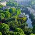 Paragon Hotel in Xiangtan with a lush river or canal view surrounded by trees and buildings