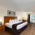 River Terrace Resort & Convention Center Gatlinburg room with king bed, stone fireplace and balcony