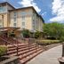 Hotel Indigo Jacksonville-Deerwood Park By IHG in Jacksonville with lakeside boardwalk and hotel exterior