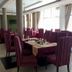 Asinuara Hotel in Bahir Dar dining room with purple chairs and large windows