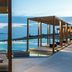 Rocabella Mykonos Hotel in Agios Stefanos with infinity pool and Aegean Sea view at dusk