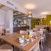 B&B HOTEL La Rochelle Centre breakfast room with tables, chairs, buffet counter and green accent wall