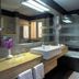TIME Grand Plaza Hotel Dubai bathroom with soaking tub, glass shower, and double sink vanity