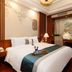 Guanyuan Liusu Hotel, Suzhou: elegant guest room with king bed and decorative wall art