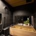 Rinn Shiki Juraku Kyoto bathroom with wooden soaking tub, rain shower and potted plant