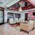 OYO Hotel Wade/Fayetteville I-95 South lobby in Fayetteville with seating area and wall-mounted TV