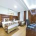 Marlight Boutique Hotel in Izmir guest room with two twin beds, wood paneling, desk and TV