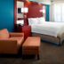 Residence Inn by Marriott Tampa Suncoast Parkway at NorthPointe Village guest room with king bed and sitting area