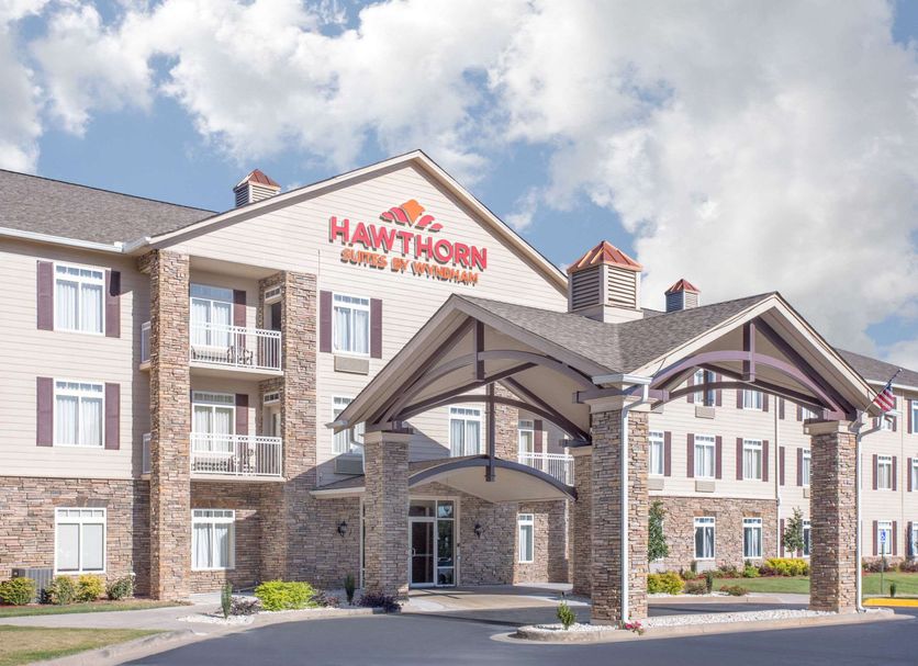 Hawthorn Extended Stay by Wyndham Conyers exterior with covered entrance and stone accents