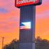 Econo Lodge Lenoir City - Knoxville Area sign glowing at sunset in Lenoir City