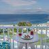 Myconian Korali Relais & Chateaux in Mykonos, sea-view balcony with table overlooking the Aegean