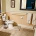 Gunn House Hotel Sonora bathroom with toilet, vanity sink, towel bars and tiled floor