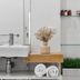Cove Studios in Byron Bay bathroom with sink, mirror, towels, and open shelf storage