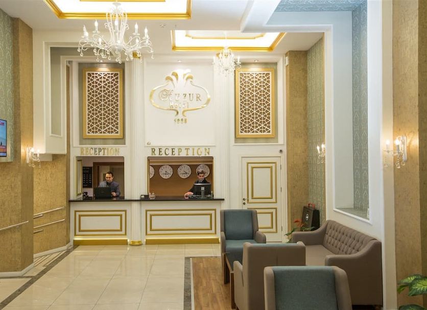 Ruba Palace Thermal Hotel Bursa reception desk in an elegant lobby with chandelier and seating
