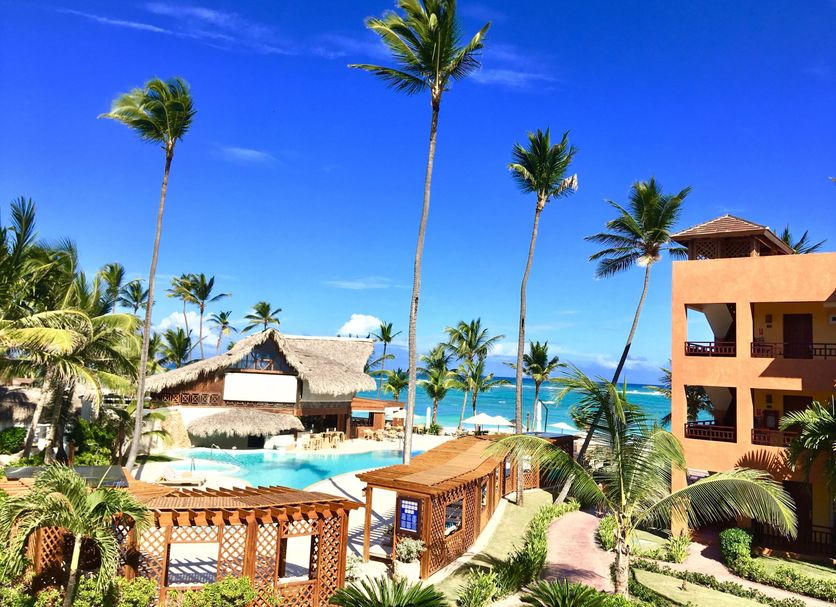 Vik Hotel Cayena Beach in Punta Cana with palm trees, pool, and ocean view