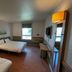 ibis budget Marseille Est Porte d'Aubagne room with two beds, desk, TV and window view in Marseille